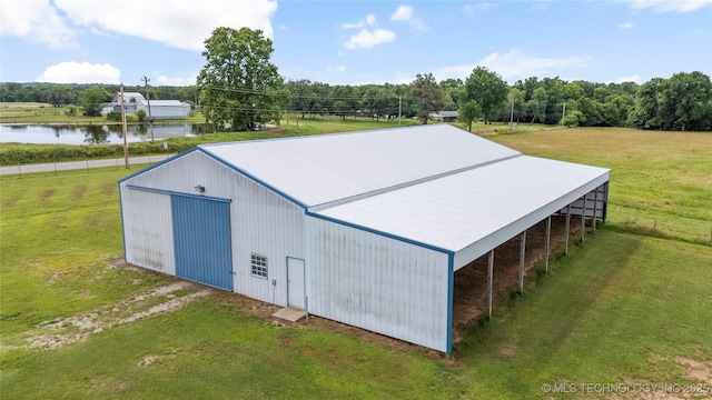 17652 S Hickory St, Sapulpa, OK 74066 - view of pole building with a yard, driveway, and a water view
