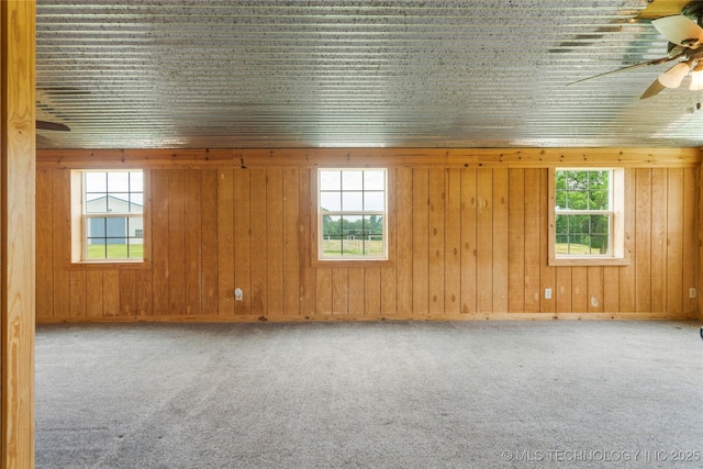 17652 S Hickory St, Sapulpa, OK 74066 - carpeted empty room with ceiling fan, healthy amount of natural light, and wooden walls