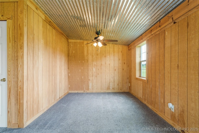17652 S Hickory St, Sapulpa, OK 74066 - empty room with a ceiling fan, wooden walls, and carpet