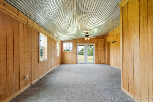 17652 S Hickory St, Sapulpa, OK 74066 - unfurnished room with ceiling fan, wood walls, carpet floors, and vaulted ceiling