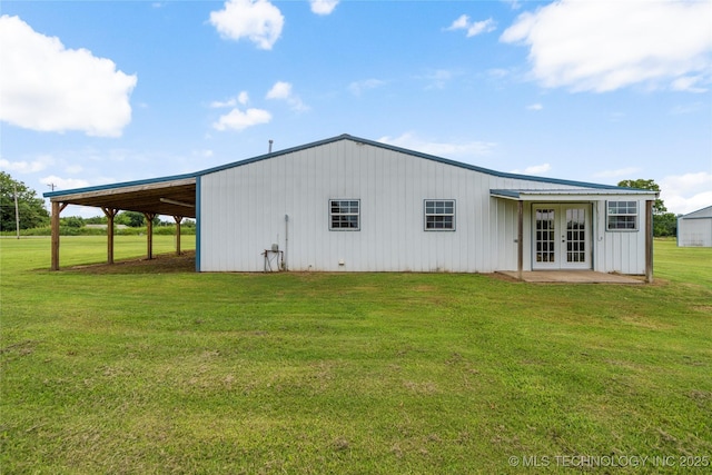 17652 S Hickory St, Sapulpa, OK 74066 - view of property exterior featuring french doors, a yard, and an attached carport