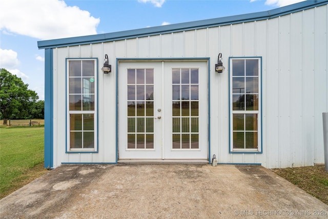 17652 S Hickory St, Sapulpa, OK 74066 - entrance to property with french doors, a yard, and board and batten siding