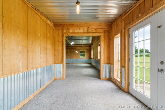 17652 S Hickory St, Sapulpa, OK 74066 - corridor with plenty of natural light, light colored carpet, and wood walls