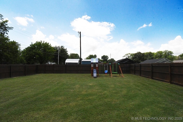401 N Ash St, Sallisaw, OK 74955 - fenced backyard featuring a playground