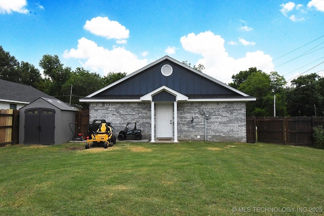 401 N Ash St, Sallisaw, OK 74955 - back of property with brick siding, a storage shed, and board and batten siding