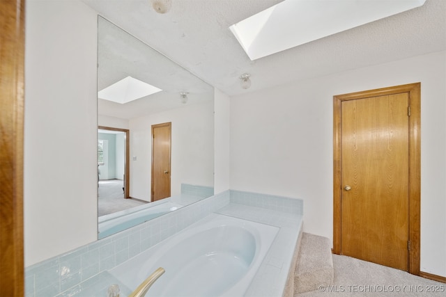 19585 Cottrell Dr, Claremore, OK 74019 - full bath featuring a skylight and a garden tub