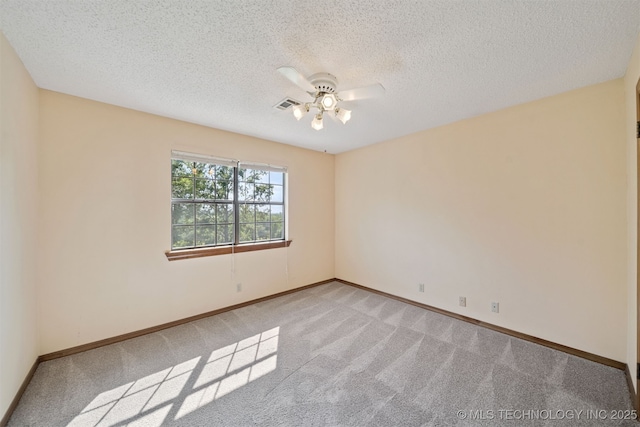 19585 Cottrell Dr, Claremore, OK 74019 - spare room with ceiling fan, light carpet, and a textured ceiling