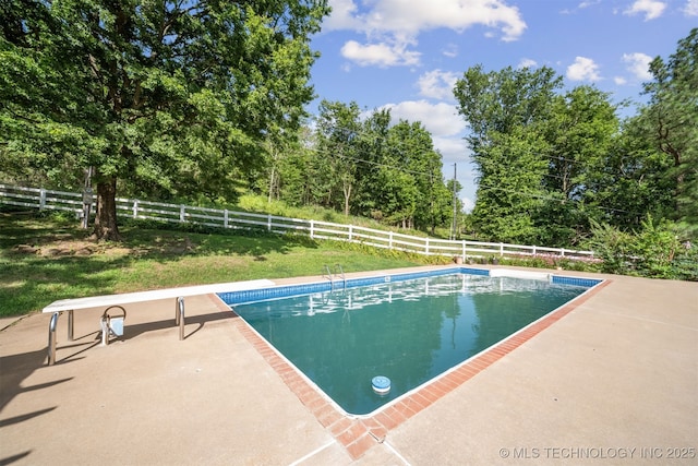19585 Cottrell Dr, Claremore, OK 74019 - view of swimming pool with a diving board, a fenced backyard, and a patio