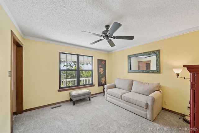 19585 Cottrell Dr, Claremore, OK 74019 - living area with crown molding, carpet flooring, a ceiling fan, and a textured ceiling