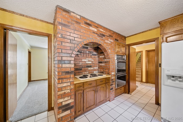 19585 Cottrell Dr, Claremore, OK 74019 - kitchen featuring white appliances, a textured ceiling, light tile patterned floors, light countertops, and crown molding