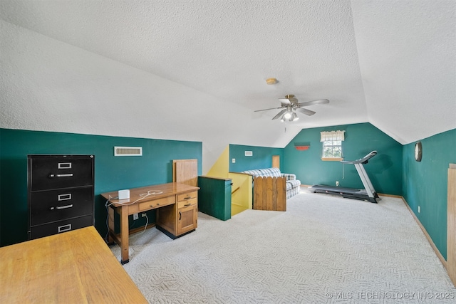 19585 Cottrell Dr, Claremore, OK 74019 - carpeted office with vaulted ceiling, a ceiling fan, and a textured ceiling
