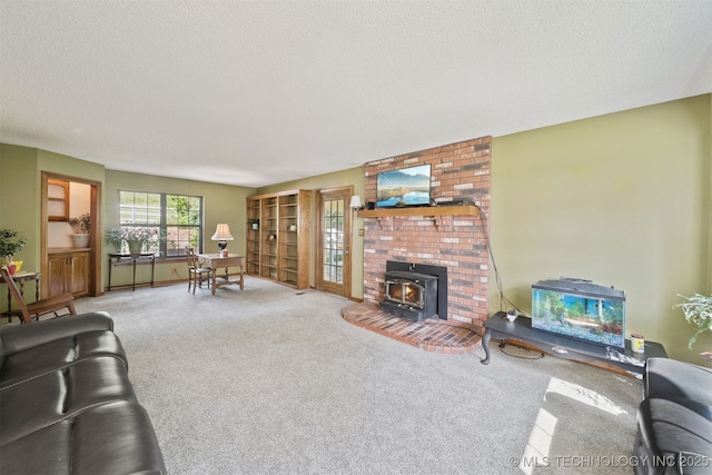 19585 Cottrell Dr, Claremore, OK 74019 - living room featuring carpet, a wood stove, and a textured ceiling