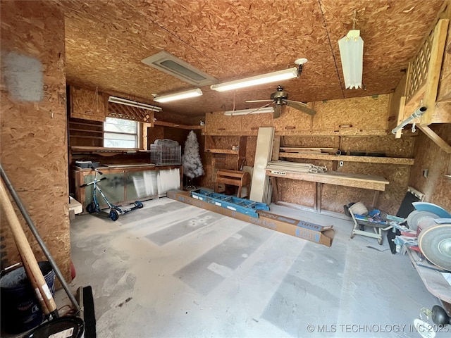 2807 Irving St, Muskogee, OK 74403 - garage featuring a workshop area and ceiling fan