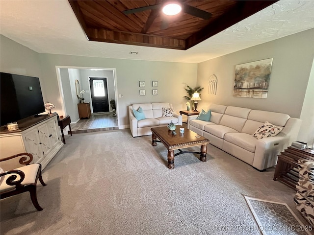 2807 Irving St, Muskogee, OK 74403 - living area with light carpet, ceiling fan, and wooden ceiling