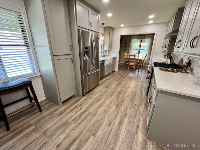 2807 Irving St, Muskogee, OK 74403 - kitchen with appliances with stainless steel finishes, gray cabinetry, light countertops, and recessed lighting