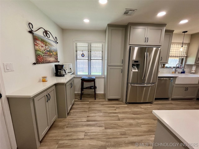 2807 Irving St, Muskogee, OK 74403 - kitchen with stainless steel appliances, gray cabinetry, recessed lighting, light countertops, and tasteful backsplash