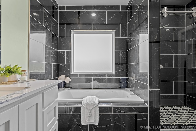 684 Chateau Bnd, Ardmore, OK 73401 - bathroom featuring vanity, a bath, and a tile shower