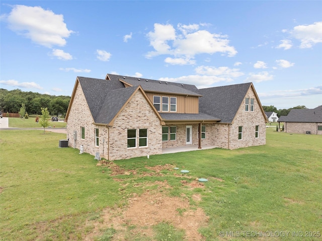 684 Chateau Bnd, Ardmore, OK 73401 - rear view of house featuring a patio, a yard, brick siding, and a shingled roof