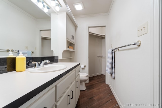 56901 E Walnut, Monkey Island, OK 74331 - bathroom with vanity, wood finished floors, ornamental molding, and a spacious closet