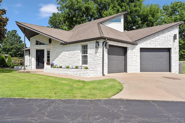 56901 E Walnut, Monkey Island, OK 74331 - view of front of home featuring an attached garage, concrete driveway, stone siding, a shingled roof, and a front yard