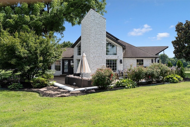 56901 E Walnut, Monkey Island, OK 74331 - rear view of property with a lawn, stone siding, a chimney, a shingled roof, and a patio area