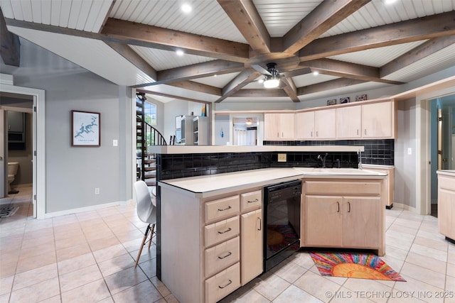56901 E Walnut, Monkey Island, OK 74331 - kitchen with black dishwasher, light brown cabinets, decorative backsplash, beam ceiling, and light countertops