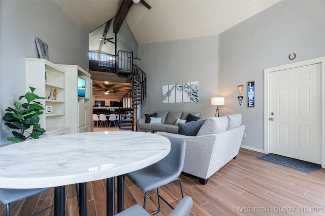 56901 E Walnut, Monkey Island, OK 74331 - living room with ceiling fan, high vaulted ceiling, wood finished floors, beam ceiling, and stairway