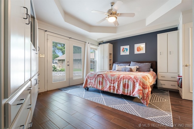 56901 E Walnut, Monkey Island, OK 74331 - bedroom featuring a tray ceiling, access to exterior, french doors, dark wood-style floors, and a ceiling fan