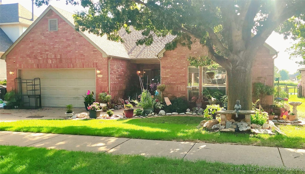 3404 N Battle Creek Dr, Broken Arrow, OK 74012 - view of front facade featuring brick siding, a garage, a shingled roof, and a front lawn