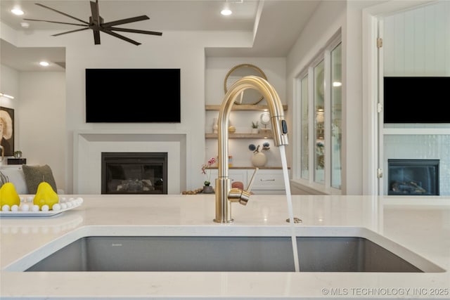 7221 E Norman St, Broken Arrow, OK 74014 - living room featuring a glass covered fireplace and recessed lighting