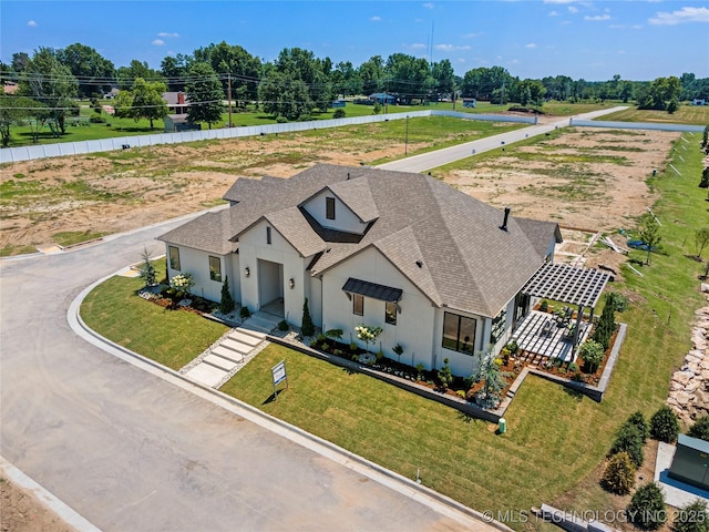 7221 E Norman St, Broken Arrow, OK 74014 - view of front of home featuring roof with shingles, a front yard, and stucco siding