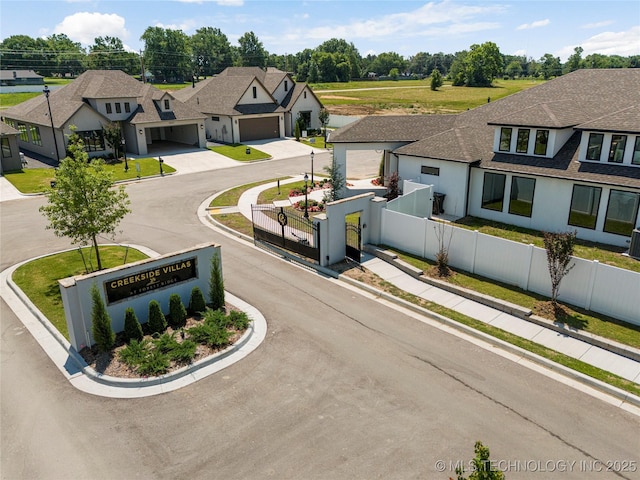 7221 E Norman St, Broken Arrow, OK 74014 - view of asphalt street with curbs, a residential view, and a gate