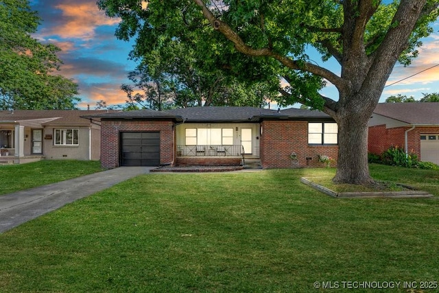 4331 E 28th St, Tulsa, OK 74114 - single story home with brick siding, a garage, concrete driveway, and a front lawn