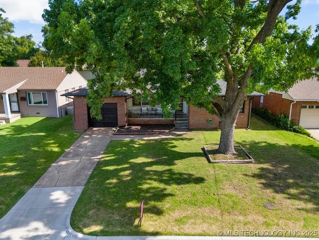 4331 E 28th St, Tulsa, OK 74114 - view of front facade with brick siding, an attached garage, concrete driveway, and a front yard