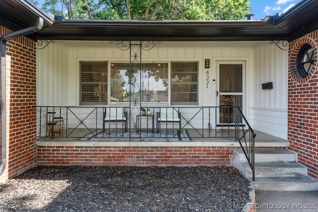 4331 E 28th St, Tulsa, OK 74114 - property entrance with brick siding and a porch