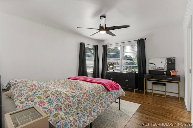 4331 E 28th St, Tulsa, OK 74114 - bedroom with wood finished floors, ornamental molding, and ceiling fan