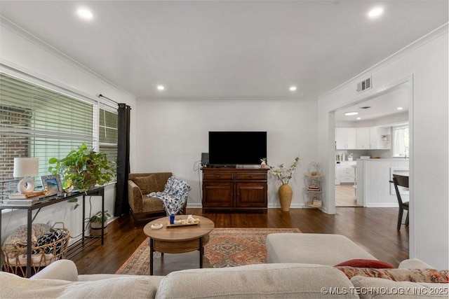 4331 E 28th St, Tulsa, OK 74114 - living room featuring ornamental molding, dark wood-style flooring, and recessed lighting