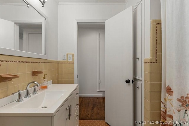 4331 E 28th St, Tulsa, OK 74114 - full bathroom with vanity, crown molding, tile walls, a shower with curtain, and wood finished floors