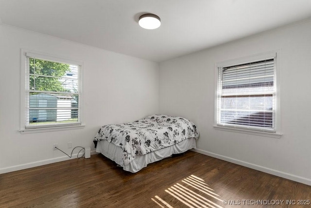 4331 E 28th St, Tulsa, OK 74114 - bedroom with ornamental molding and dark wood-type flooring