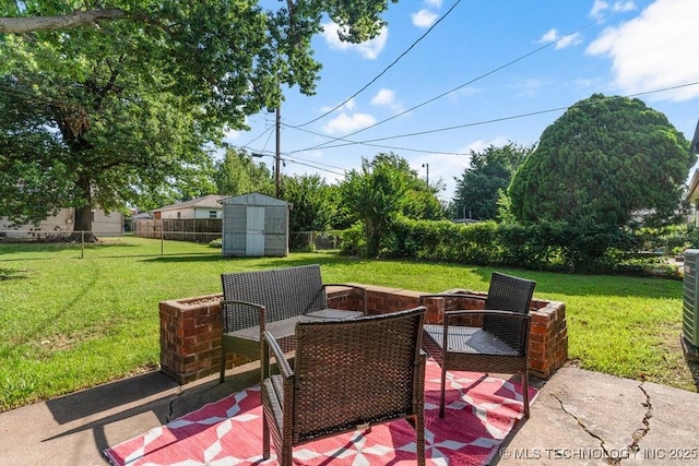 4331 E 28th St, Tulsa, OK 74114 - fenced backyard featuring a patio area and a storage shed