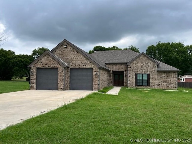 408 S Donehoo, Kingston, OK 73439 - view of front of property with an attached garage, a front yard, french doors, and concrete driveway