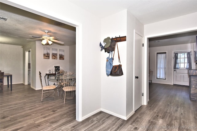 11003 E 27th St, Tulsa, OK 74129 - hallway featuring dark wood-style flooring and baseboards