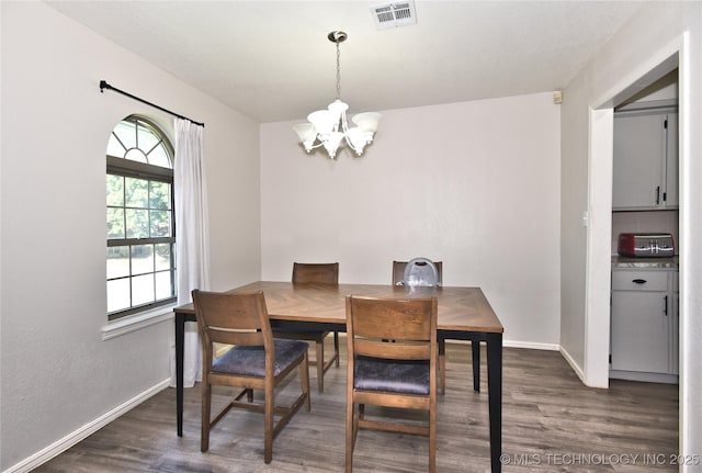 11003 E 27th St, Tulsa, OK 74129 - dining area with a chandelier and dark wood-style flooring
