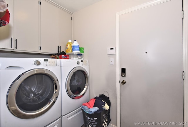 11003 E 27th St, Tulsa, OK 74129 - laundry room featuring washing machine and clothes dryer and cabinet space