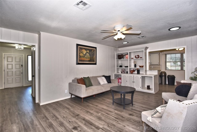 11003 E 27th St, Tulsa, OK 74129 - living room with dark wood-style floors, ceiling fan, a textured ceiling, recessed lighting, and ornamental molding