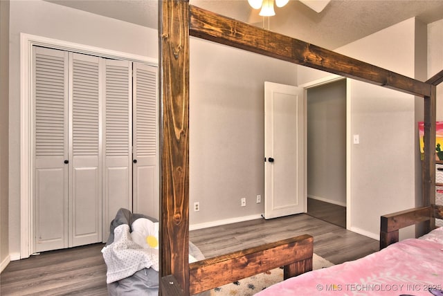 11003 E 27th St, Tulsa, OK 74129 - bedroom with dark wood-style floors and a closet