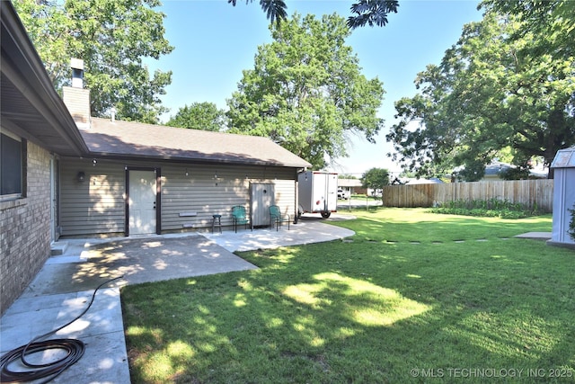 11003 E 27th St, Tulsa, OK 74129 - view of yard featuring a patio area and a storage shed