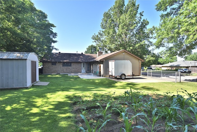11003 E 27th St, Tulsa, OK 74129 - rear view of house with a shed, a chimney, a patio, and brick siding