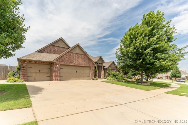 9314 N 96th E Ave, Owasso, OK 74055 - view of front facade with brick siding, an attached garage, driveway, and roof with shingles