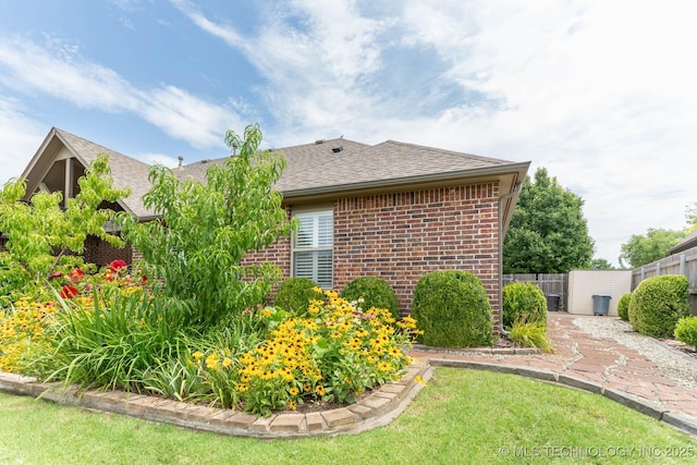 9314 N 96th E Ave, Owasso, OK 74055 - view of side of property with brick siding and roof with shingles